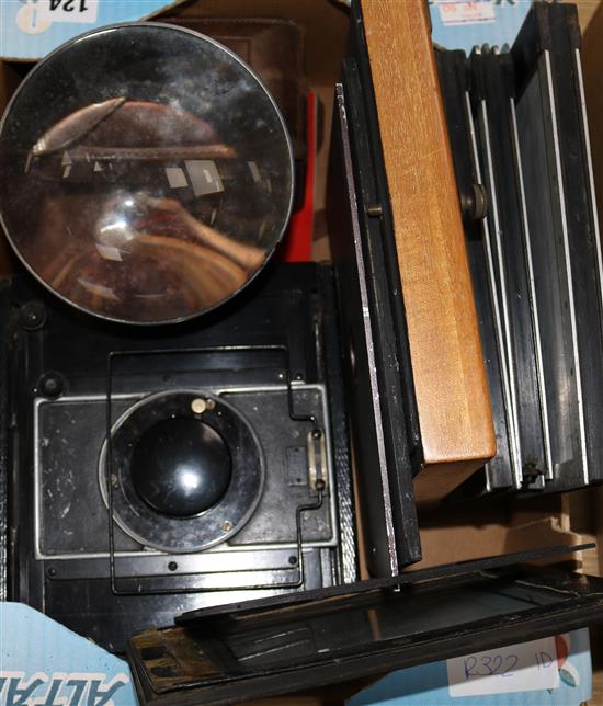 A Rolleiflex camera no.281485 and a German plate camera and backs